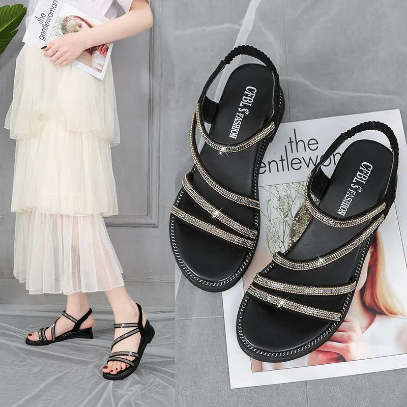 Women's silver Korean style flat sandals with elastic band and rhinestone decoration on a rubber sole.