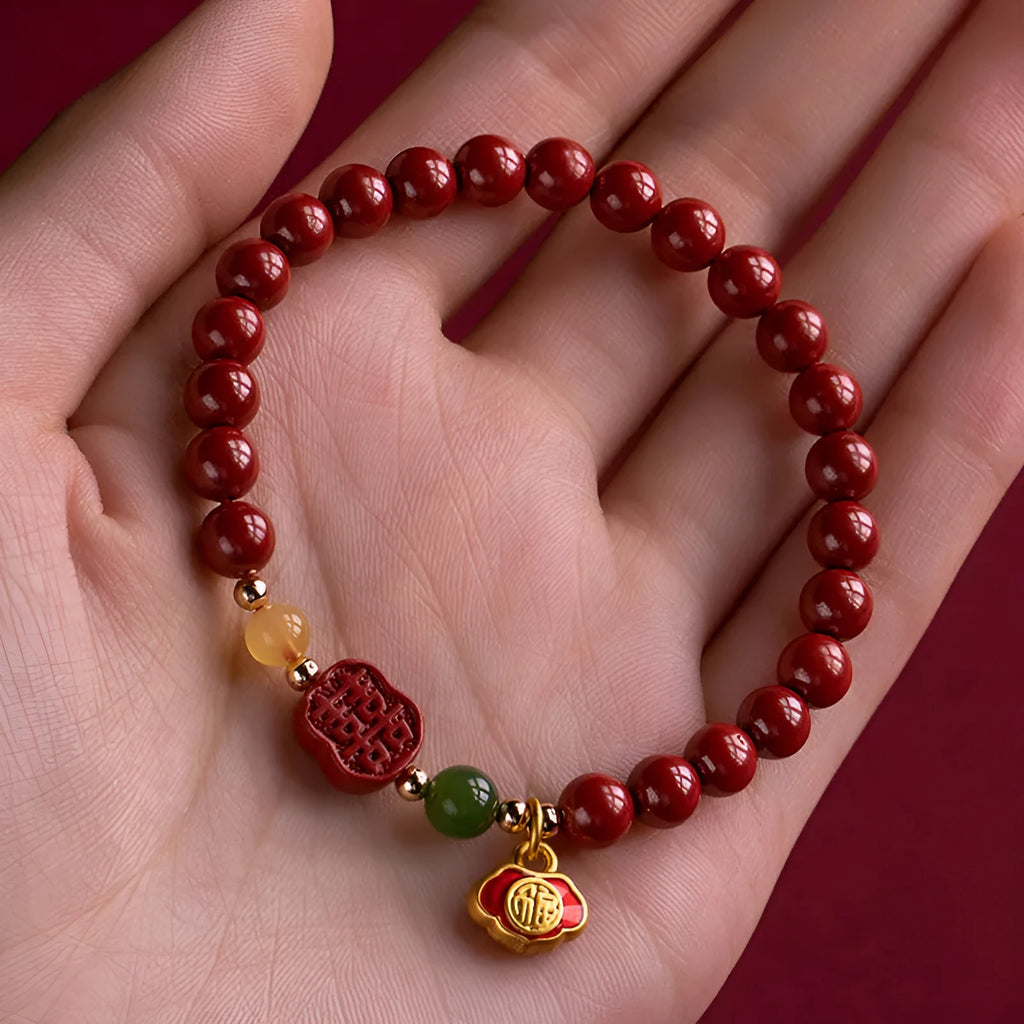 Emperor sandstone cinnabar bracelet with fu character and happy eyebrow design