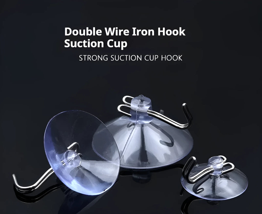 PVC suction disc hooks in assorted sizes and styles including iron hooks and key ring sucker on a glass surface