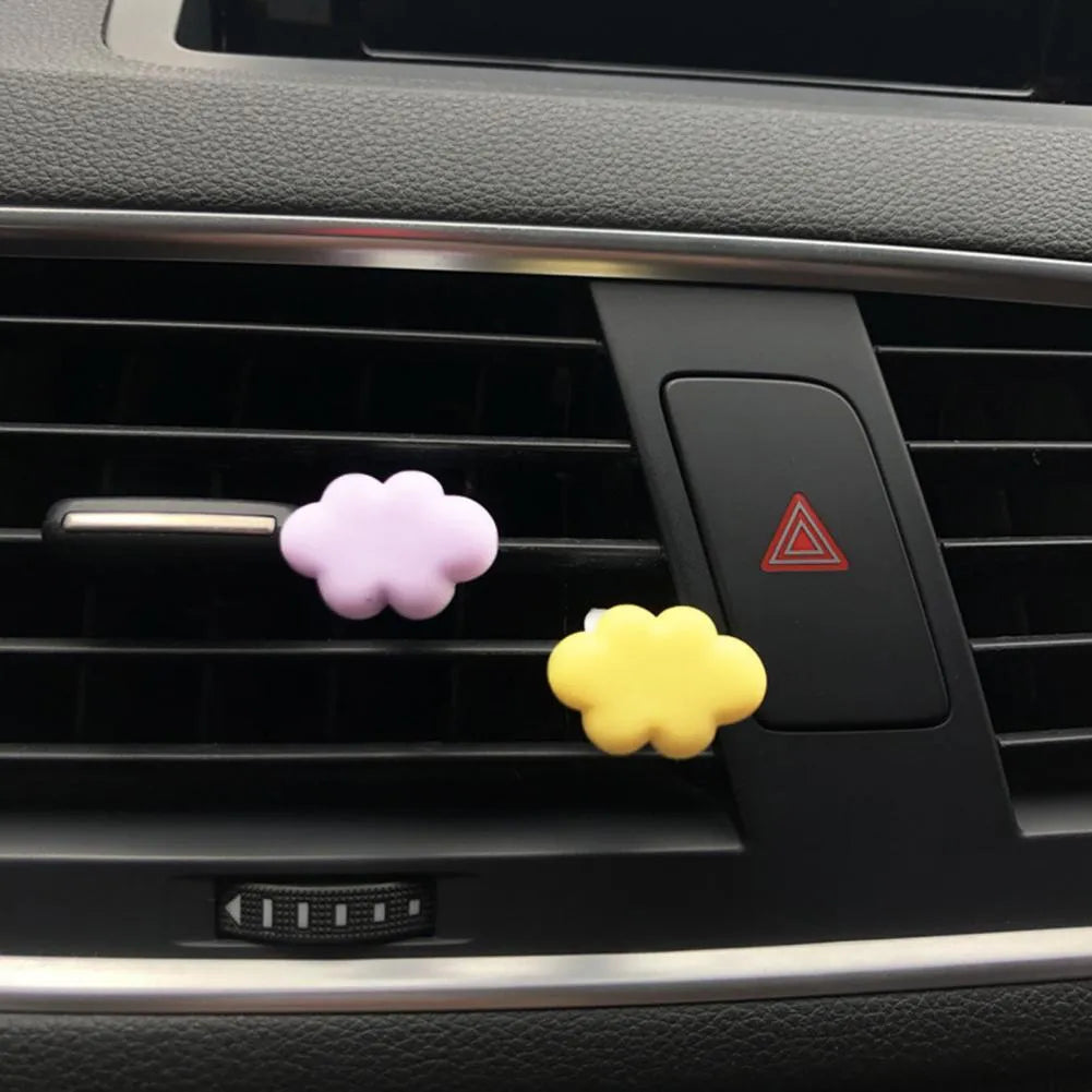 Resin cartoon Baiyun cloud car air freshener clip in light green, shown attached to a car air vent.