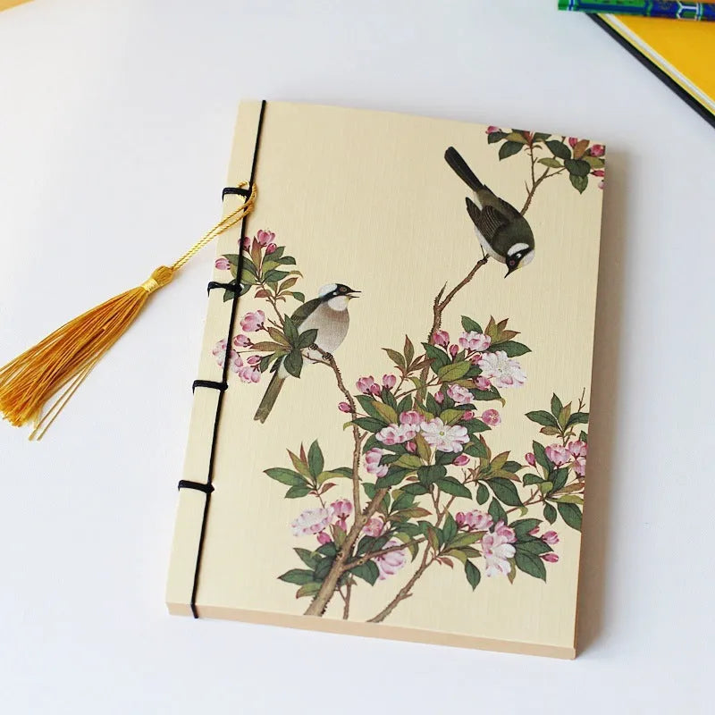 A5 antique thread-bound notebook with embossed cover and decorative tassels