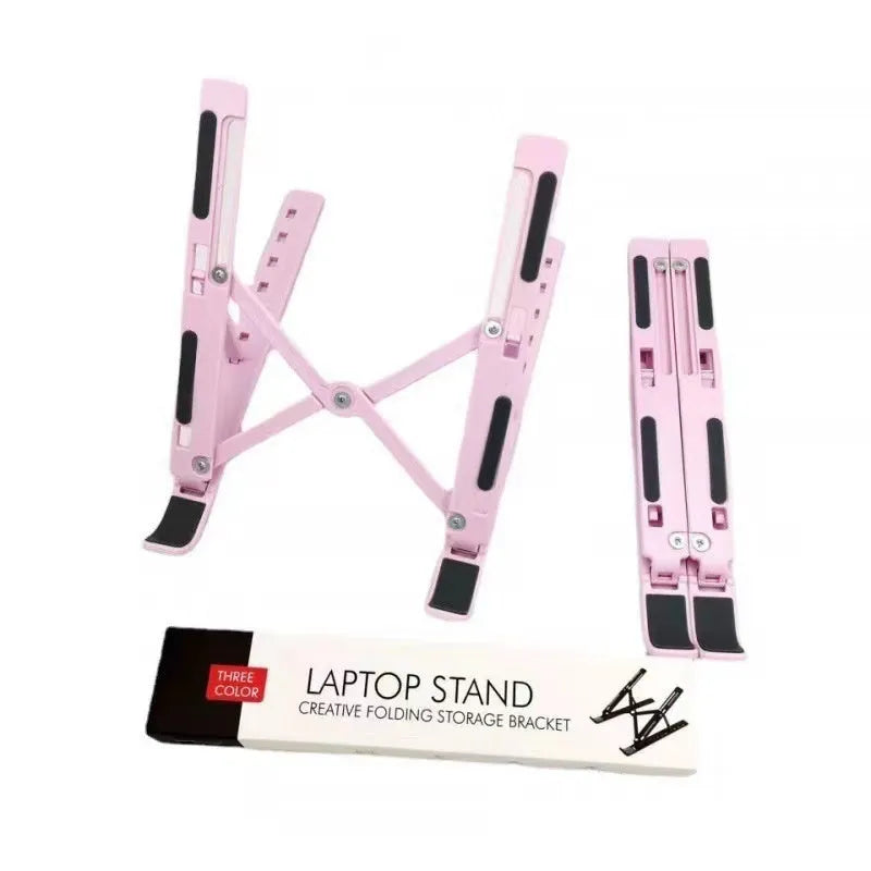 Silver aluminum folding laptop stand open on a desk with a laptop.