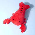 Red crab lobster squeaky stuffed chew toy for small and medium-sized dogs on a white background.