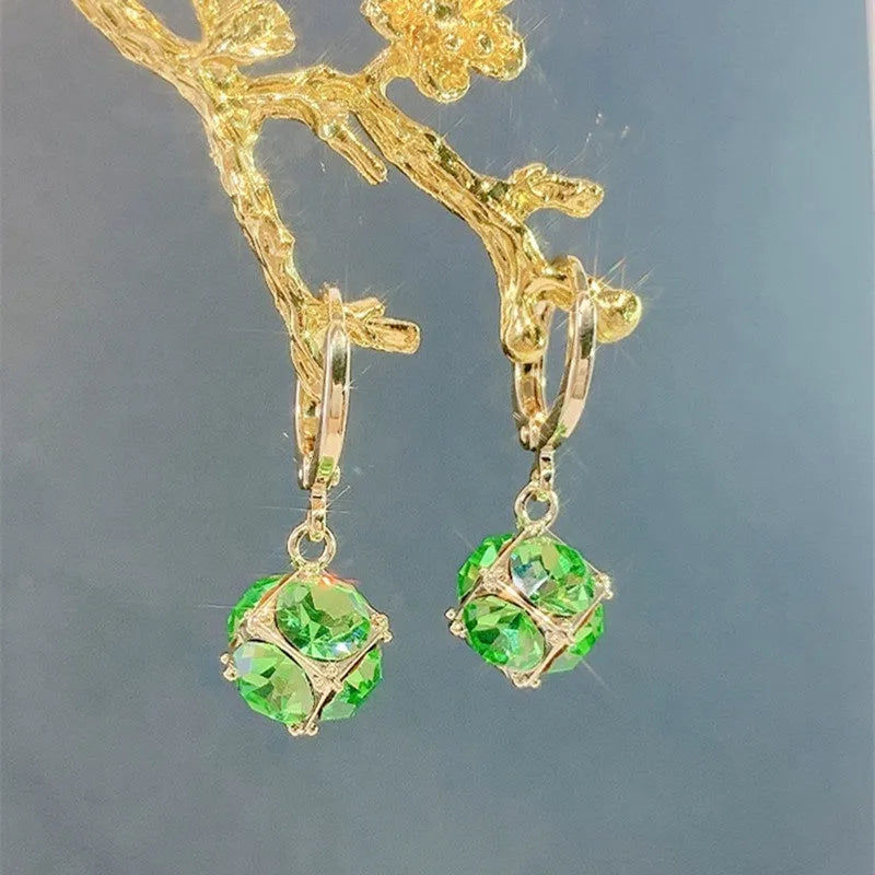 Geometric copper earrings with rose design elements and zircon detail in silver electroplated finish