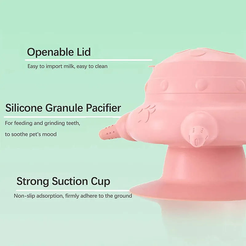 Pink silicone pet nursing bottle with bionic breast design and four pacifiers on a flat base.