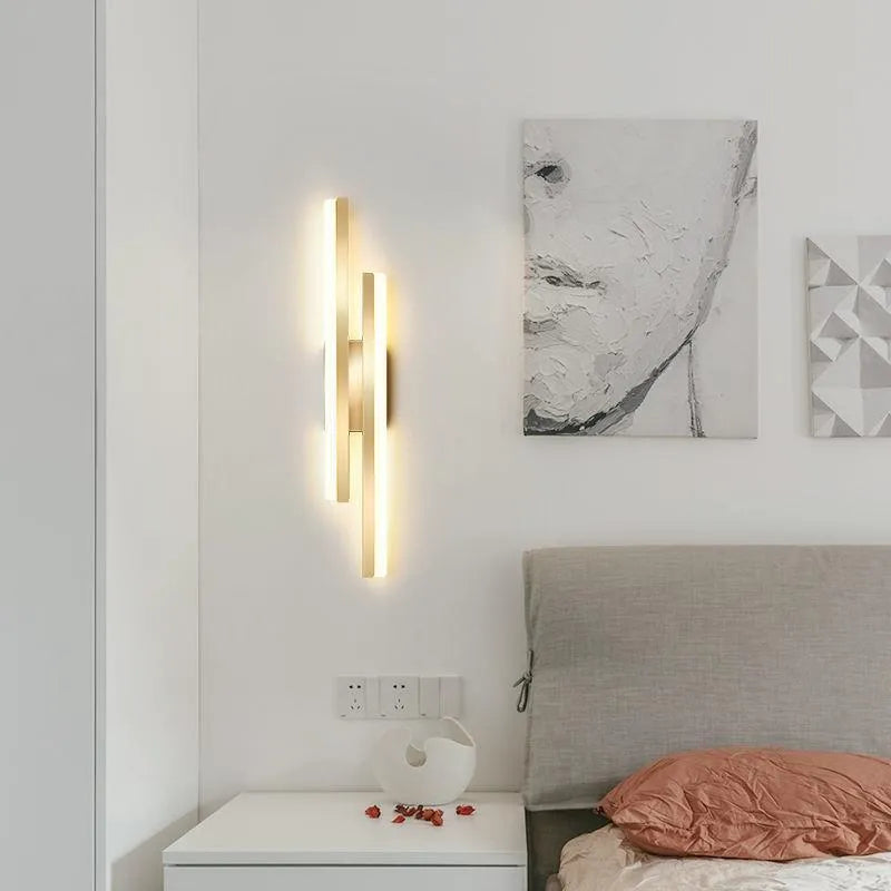 Minimalist Scandinavian LED wall light with black metal arm and white acrylic shade mounted on a wall.