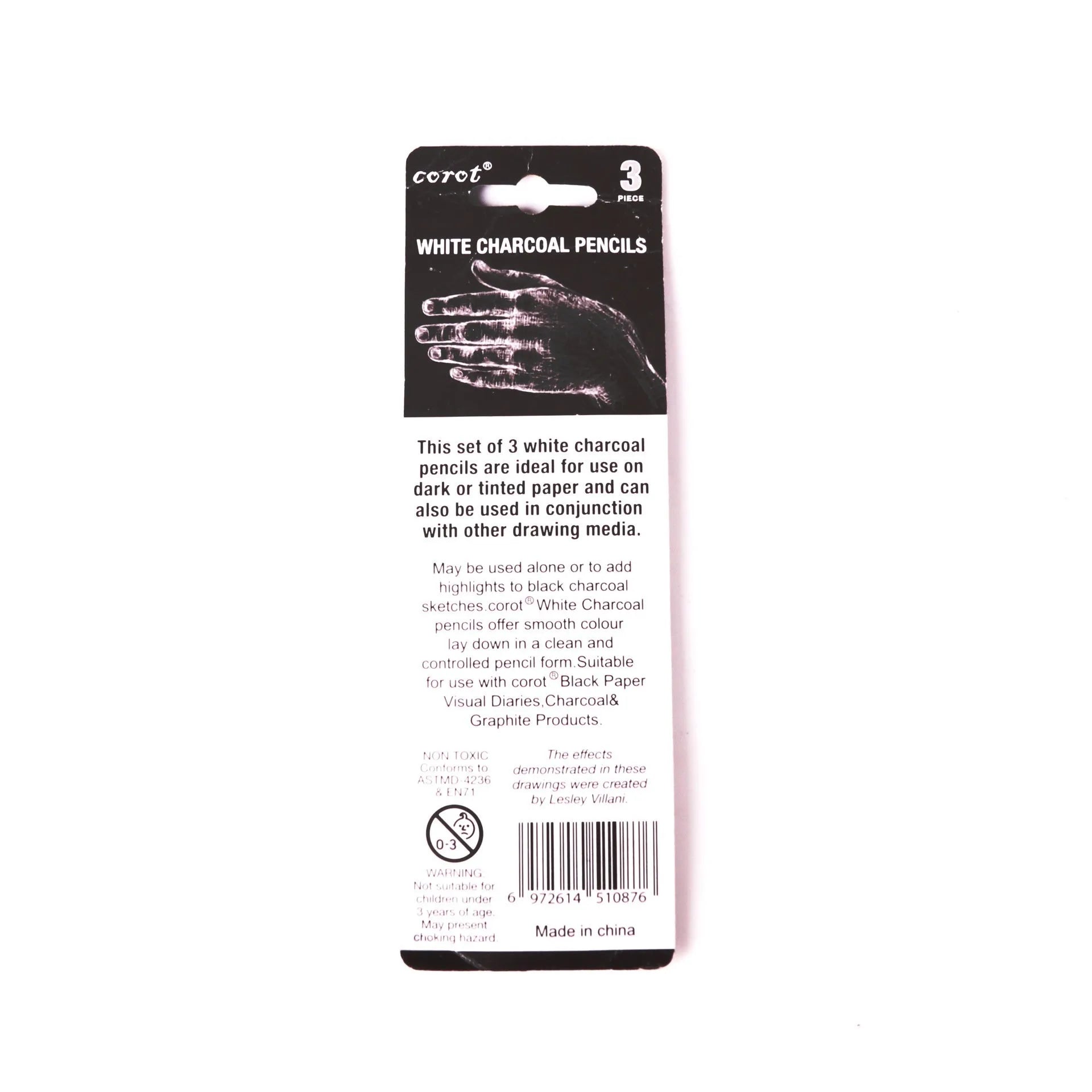 Three white charcoal pencils in wooden casings for art sketching on dark paper