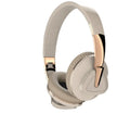 Wireless over-ear headset in black with soft ear cushions, showing AUX audio jack port.