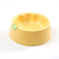 Green plastic double pet bowl with flower-shaped feeding areas and anti-tipping base design