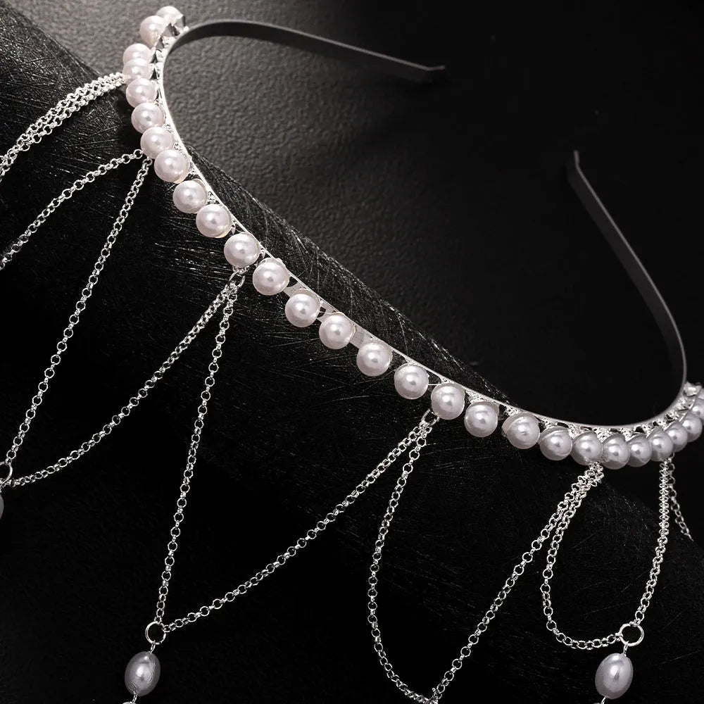 Gold and pearl mesh hair chain for women with a dangling tassel accessory.