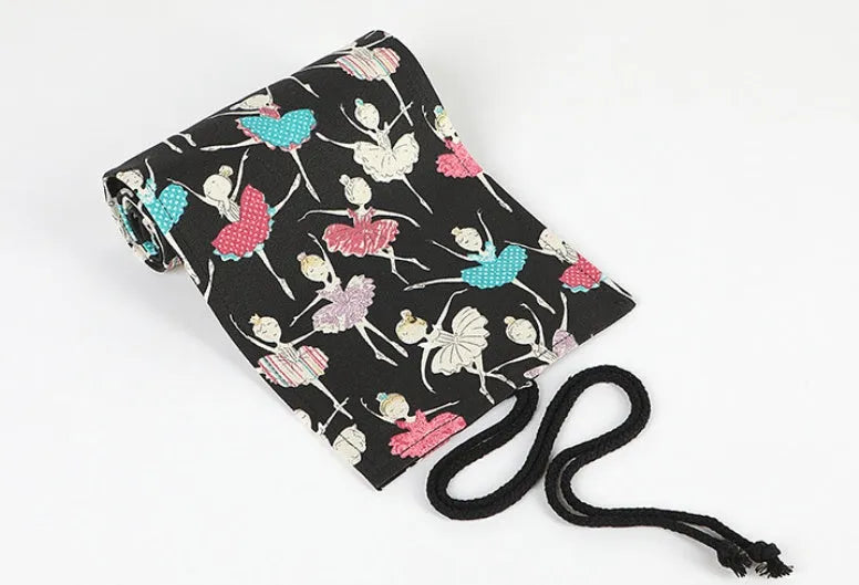 Square canvas rolling pencil case with ballet girl print, shown with curtain unrolled to reveal multiple pencil holes.