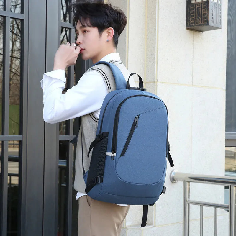 Oxford cloth casual backpack in blue, open to show interior, with a laptop inside.