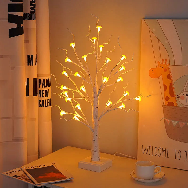 60cm tall white birch tree LED lamp with 24 small lit mushroom flowers on its branches.