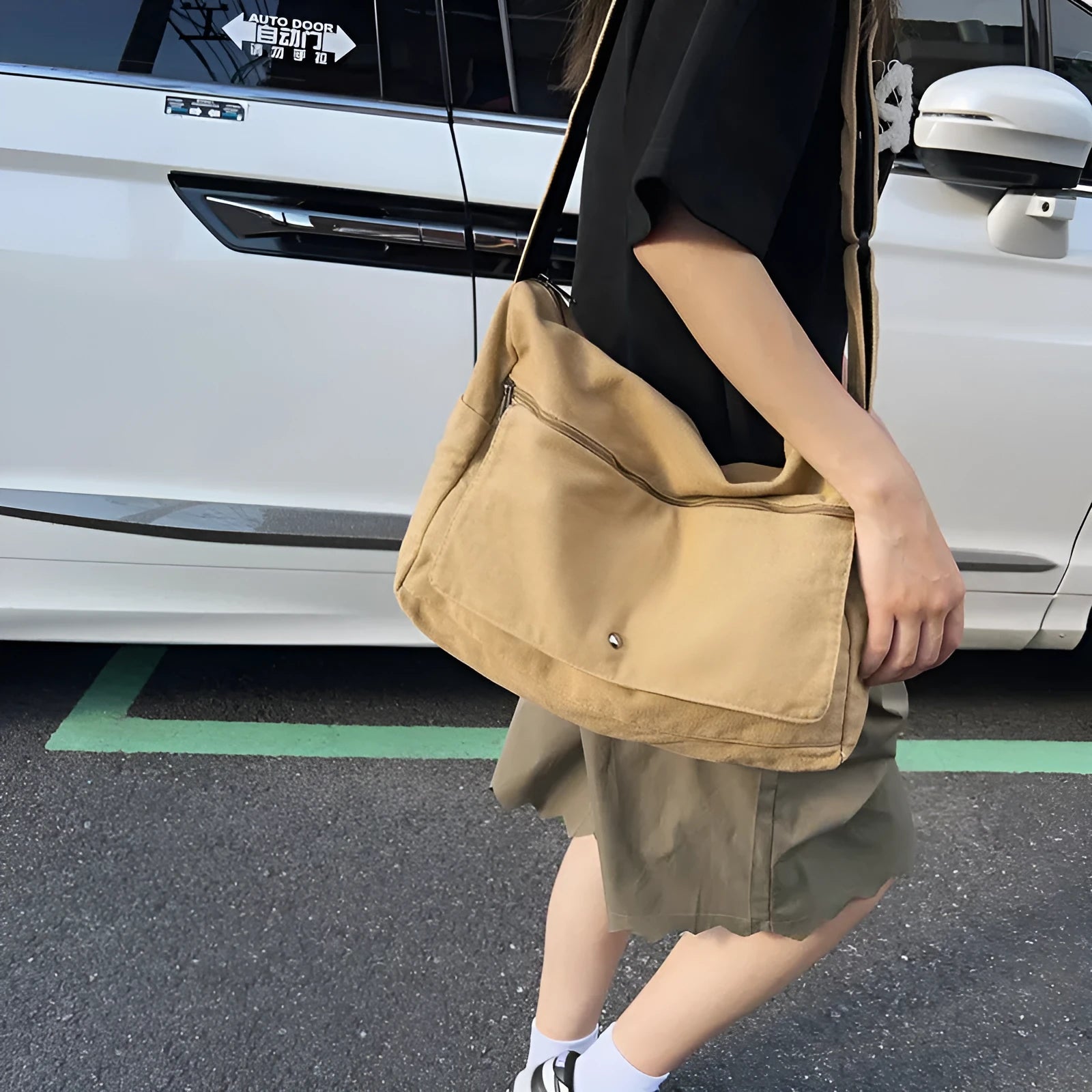 Washed canvas draping women's crossbody bag in black soft horizontal square shape