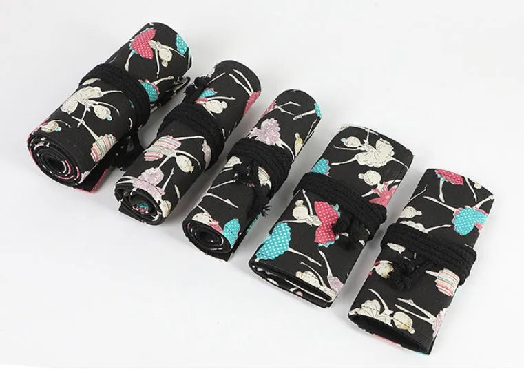 Square canvas rolling pencil case with ballet girl print, shown with curtain unrolled to reveal multiple pencil holes.