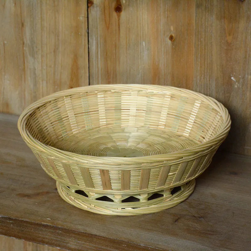 Handmade natural bamboo storage basket shown in one of three size variations for household organisation.