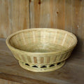 Handmade natural bamboo storage basket shown in one of three size variations for household organisation.