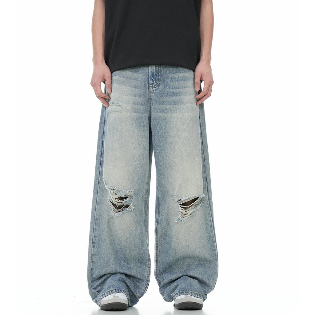 Blue men's straight-leg jeans with a distressed retro finish and a zipper fly.