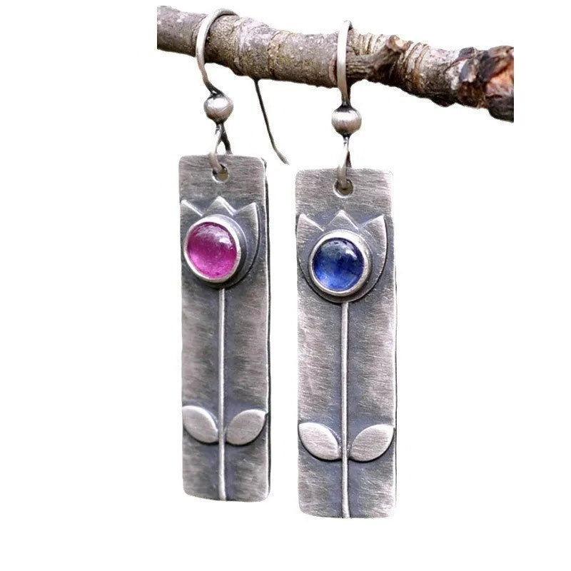 Red sapphire earrings with antique electroplated finish and geometric ellipse design