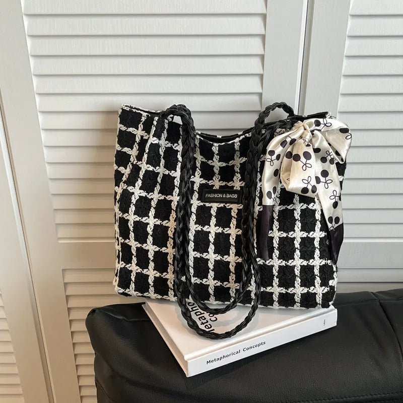 Black wool blend horizontal square shoulder bag with internal compartments for commuting and shopping