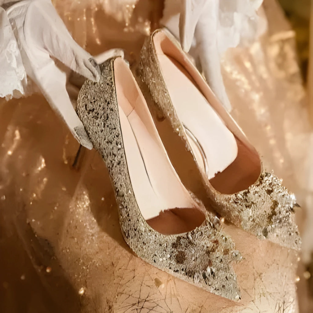 Champagne coloured pointed toe bridal shoes with rhinestone decoration on a fine heel.