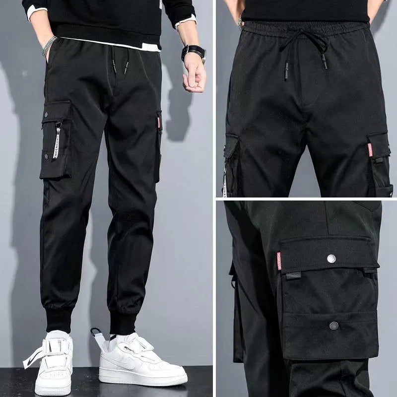 Men's cotton-polyester sports overalls in black with embossed finish and printed details, side view