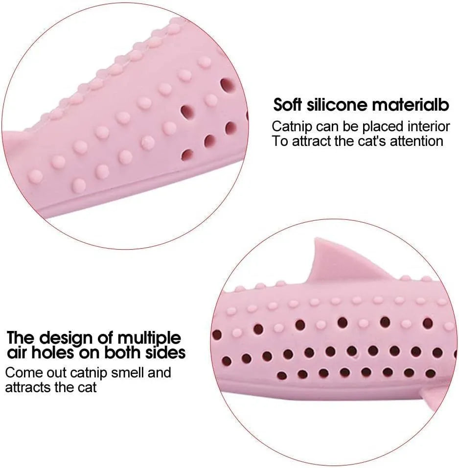 Green silicone fish-shaped cat chew toy with side holes on a white background.