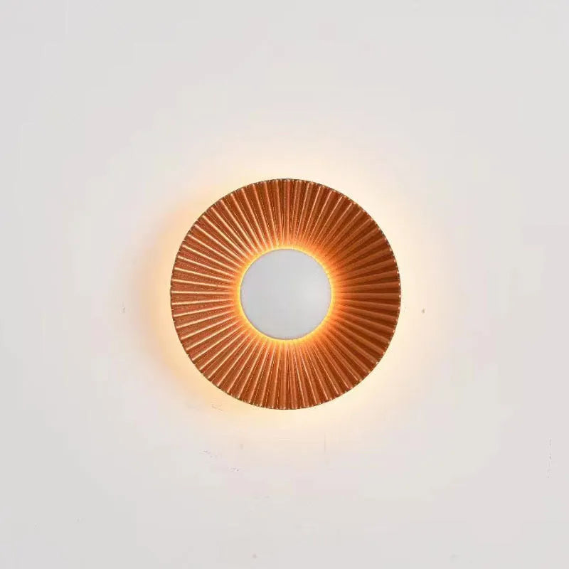 Round aluminium LED wall lamp in a choice of six colour finishes for bedroom or living room.