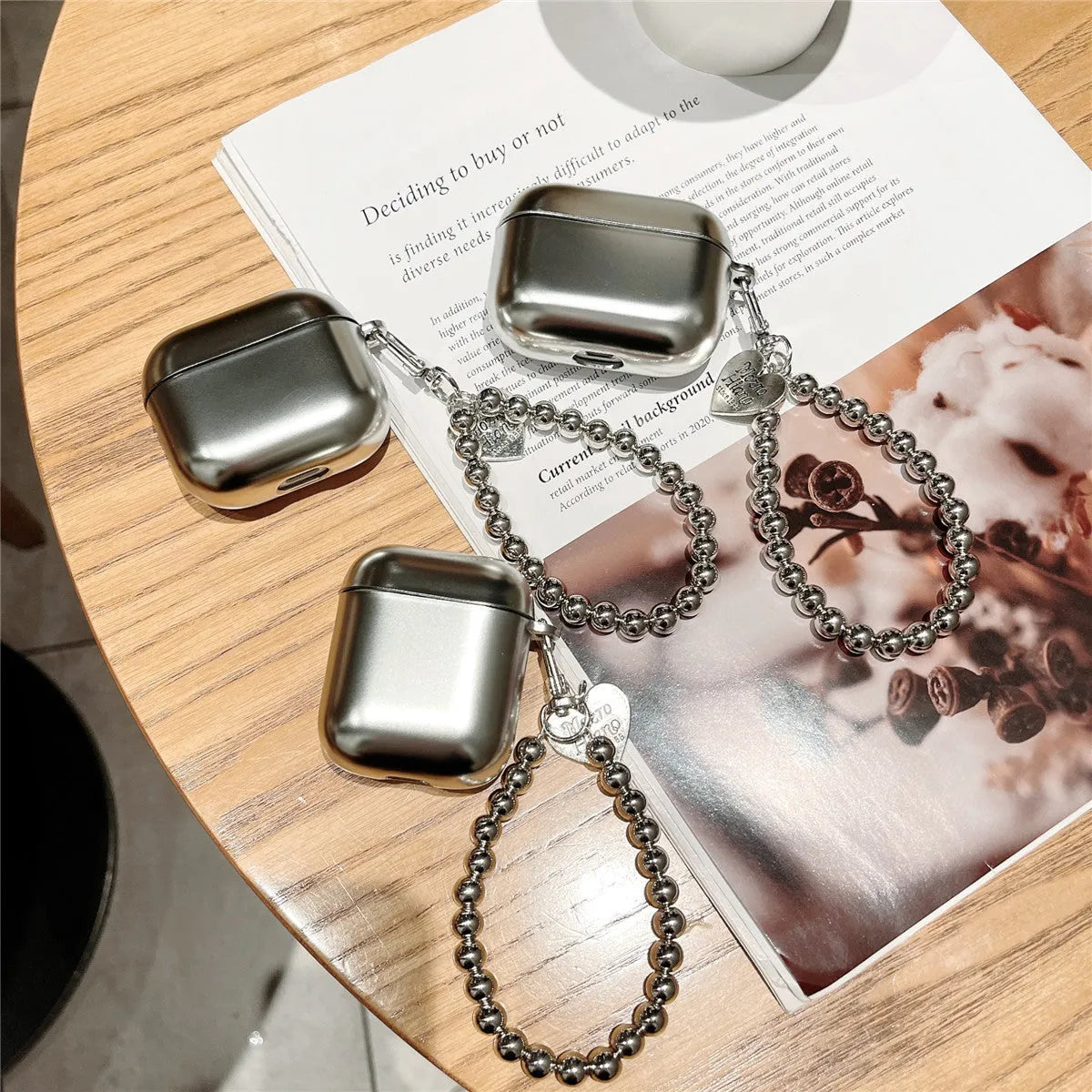 Matte plating protective case for AirPods with integrated bracelet showing electroplated finish