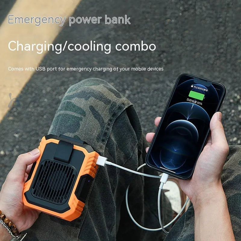 Green wrist hanging personal fan with blades, LED light, and USB charging port on a strap.