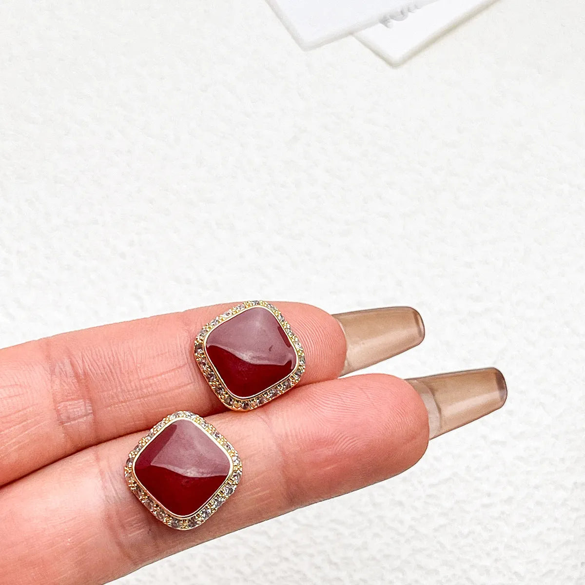 Red square plate earrings with geometric alloy construction and retro styling