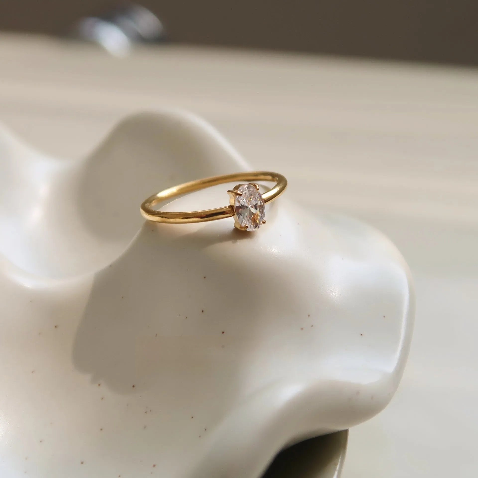 Golden love heart stainless steel ring on finger showing heart-shaped design element