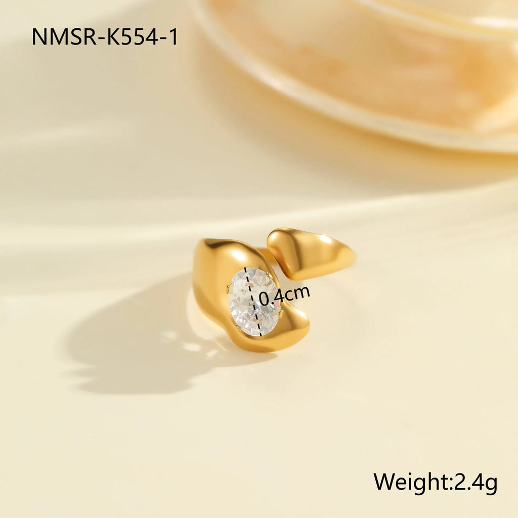 Women's stainless steel geometric zircon ring with open mouth design on a hand.