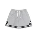 Men's loose polyester sports shorts in multiple colours on a size chart background.