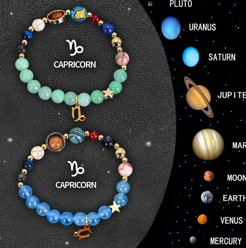 Set of two natural stone beaded bracelets for zodiac signs on a flat surface