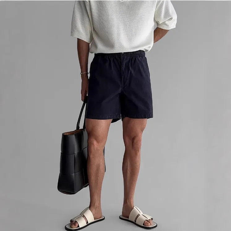 Cotton loose fit sports shorts in black colour showing short length design