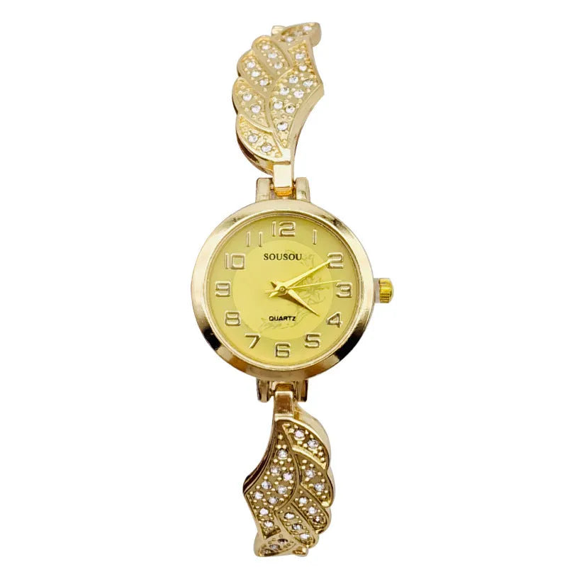 Women's stainless steel watch with round dial showing gold face colour option on wrist.