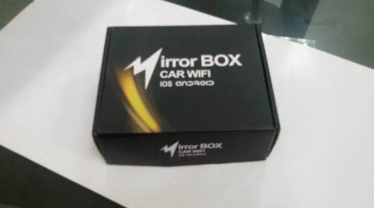 Black car mirror link box Wi-Fi converter with antenna, power cable and AV cable for streaming phone to car screen.