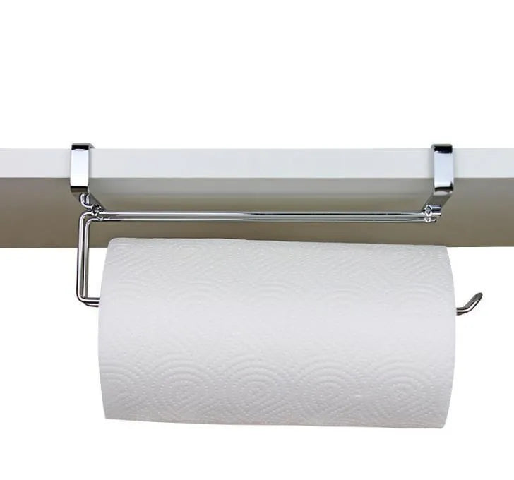 Silver stainless steel paper towel rack hanging on a cabinet door.