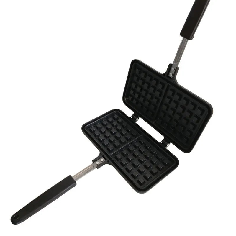 Black non-stick aluminium waffle plaid cake mold with locking handle on gas stove