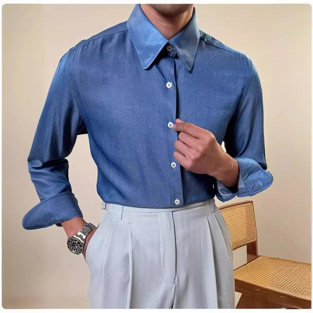 Man wearing a slim-fit light blue round collar long sleeve shirt for business casual wear.