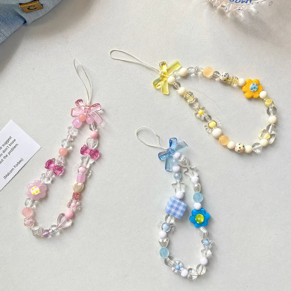 Colourful beaded flower mobile phone lanyard with hand rope design in blue, pink and yellow options