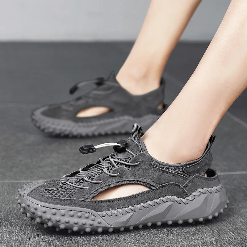 Men's black waterproof casual sports sandals with a leather mesh upper, elastic band, and rubber sole.