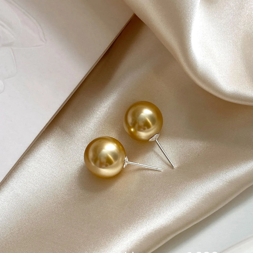 Large pearl stud earrings with geometric star design in silver with various pearl size options