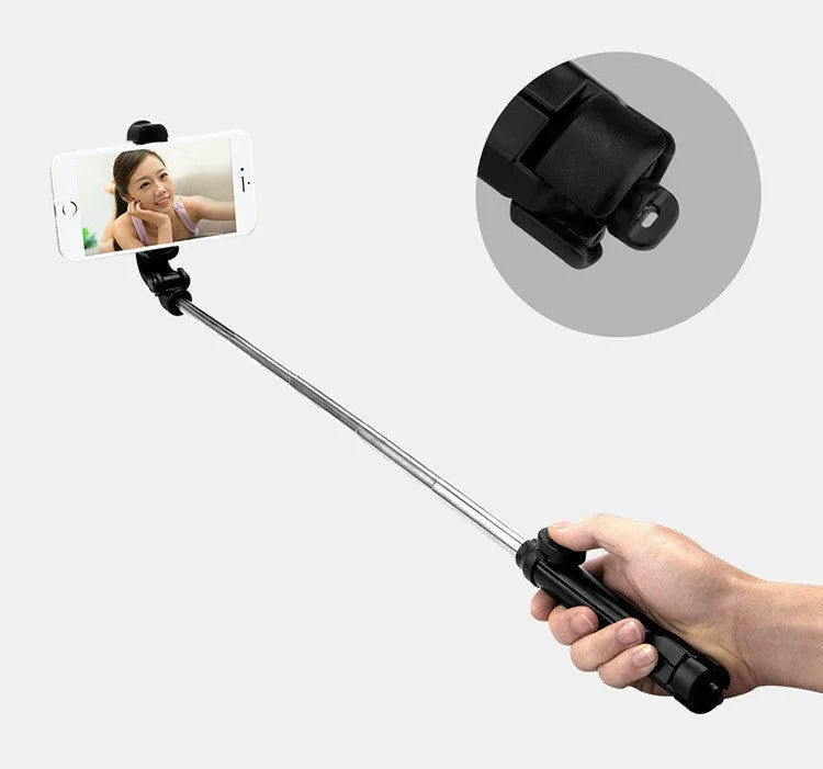 Black Bluetooth tripod selfie stand for iPhone with extended legs and rotating phone clip