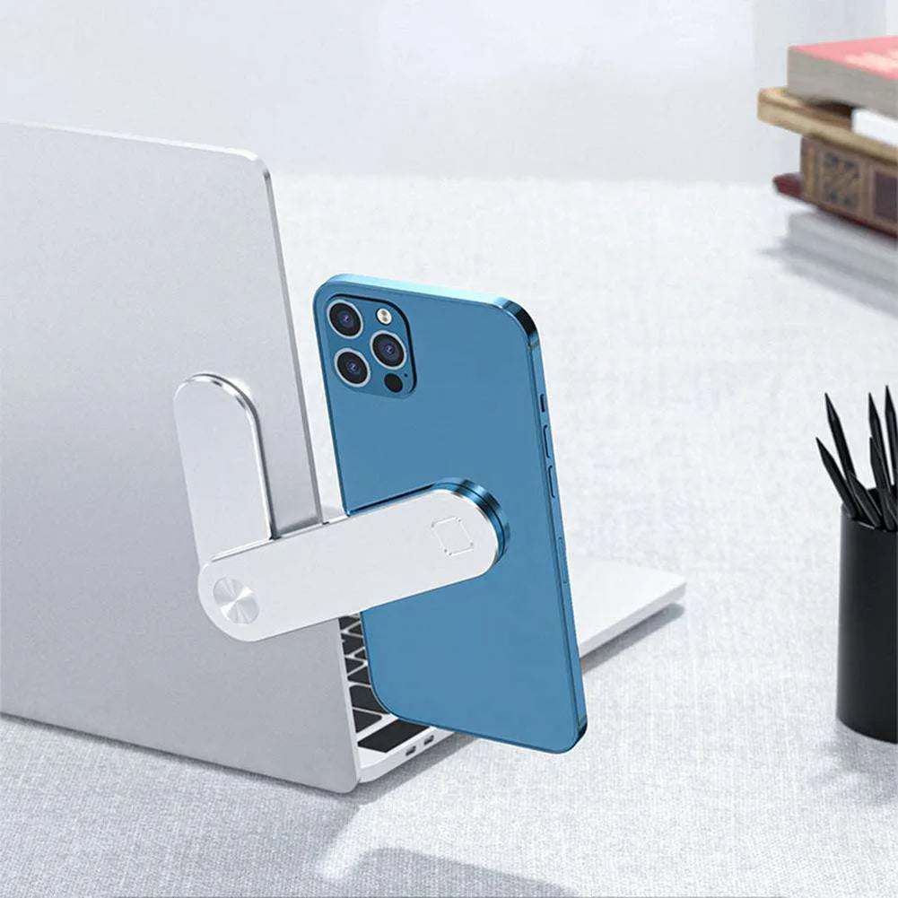 Black aluminium laptop phone holder with magnetic mount attached to a laptop screen.