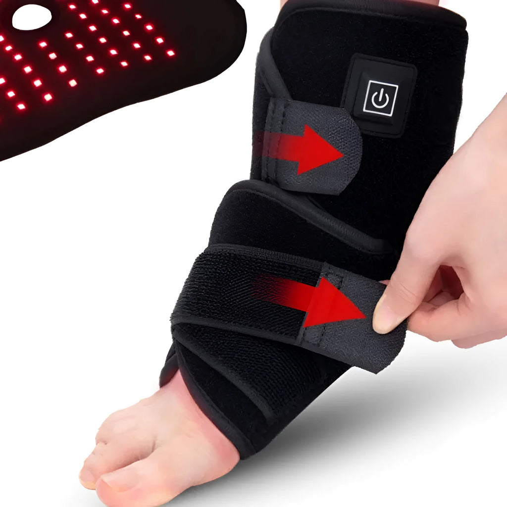 Black ankle heating wrap with red light therapy and USB cable on flat surface