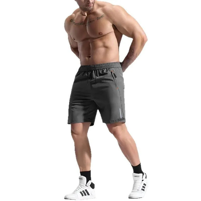 Men's grey elastic waist sports shorts made from bamboo fibre polyester fabric on a plain background.