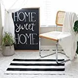 Cotton buffalo plaid rug in classic pattern on a light floor, showing non-slip backing