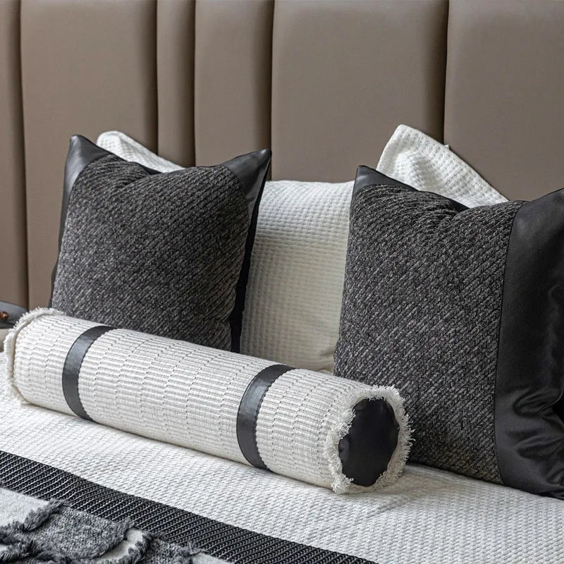 Modern minimalist grey and white plaid bed runner set with pillowcase and round leather pillow on bed